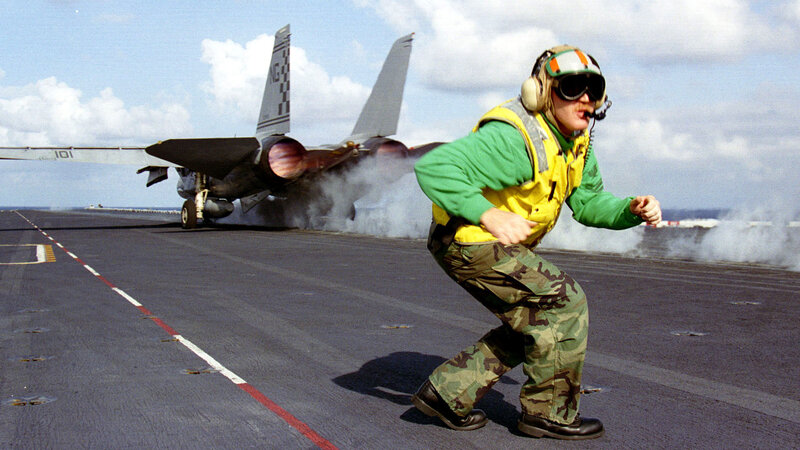 Aircrew on aircraft carrier deck