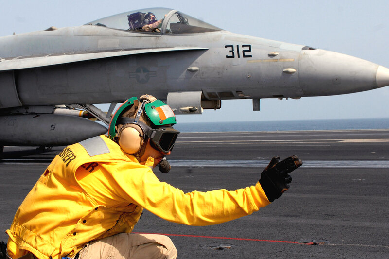 Aircrew on aircraft carrier deck