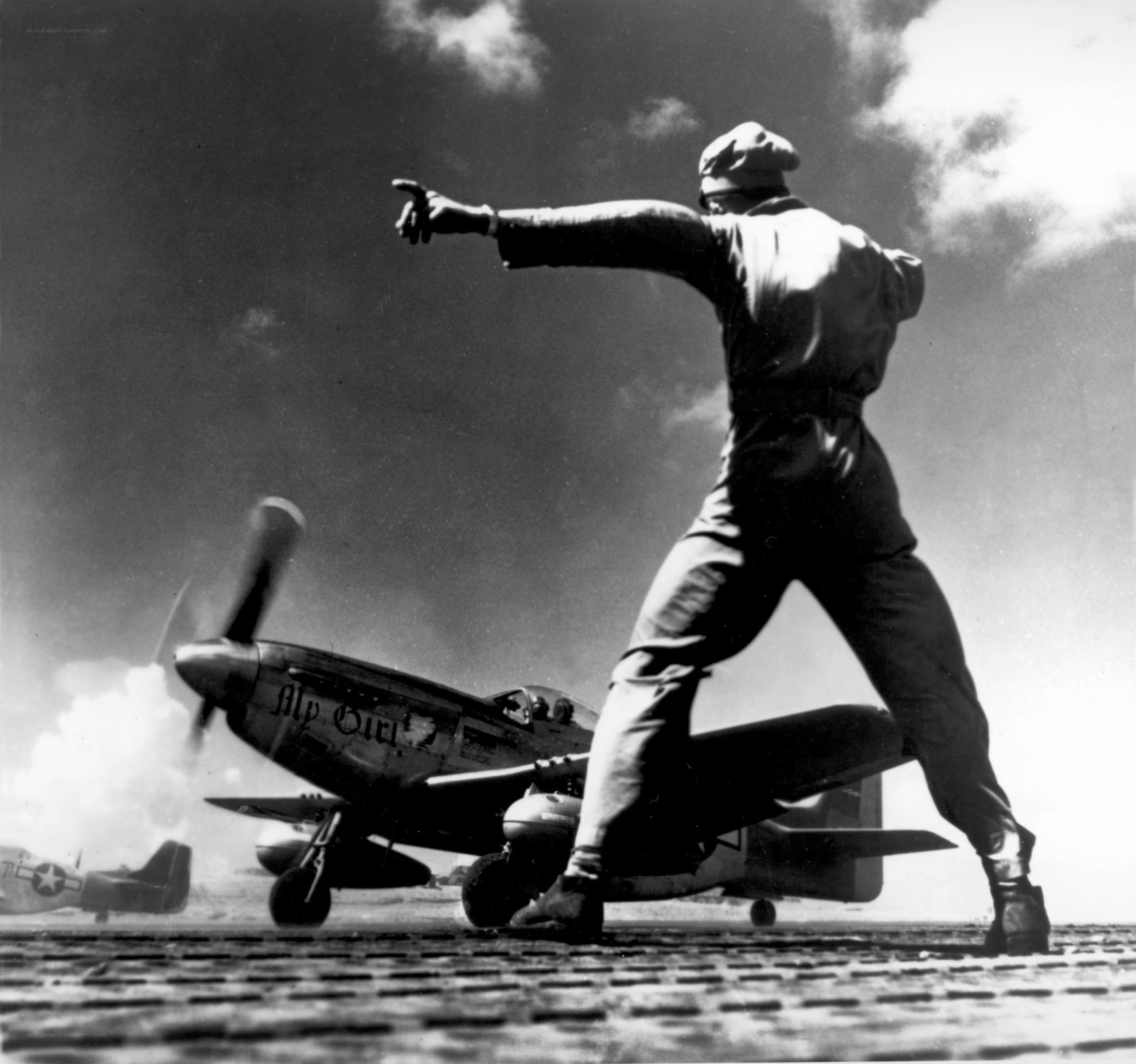Airfield ground crew directing aircraft