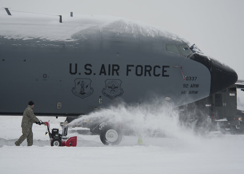 Airman Clearing Snow