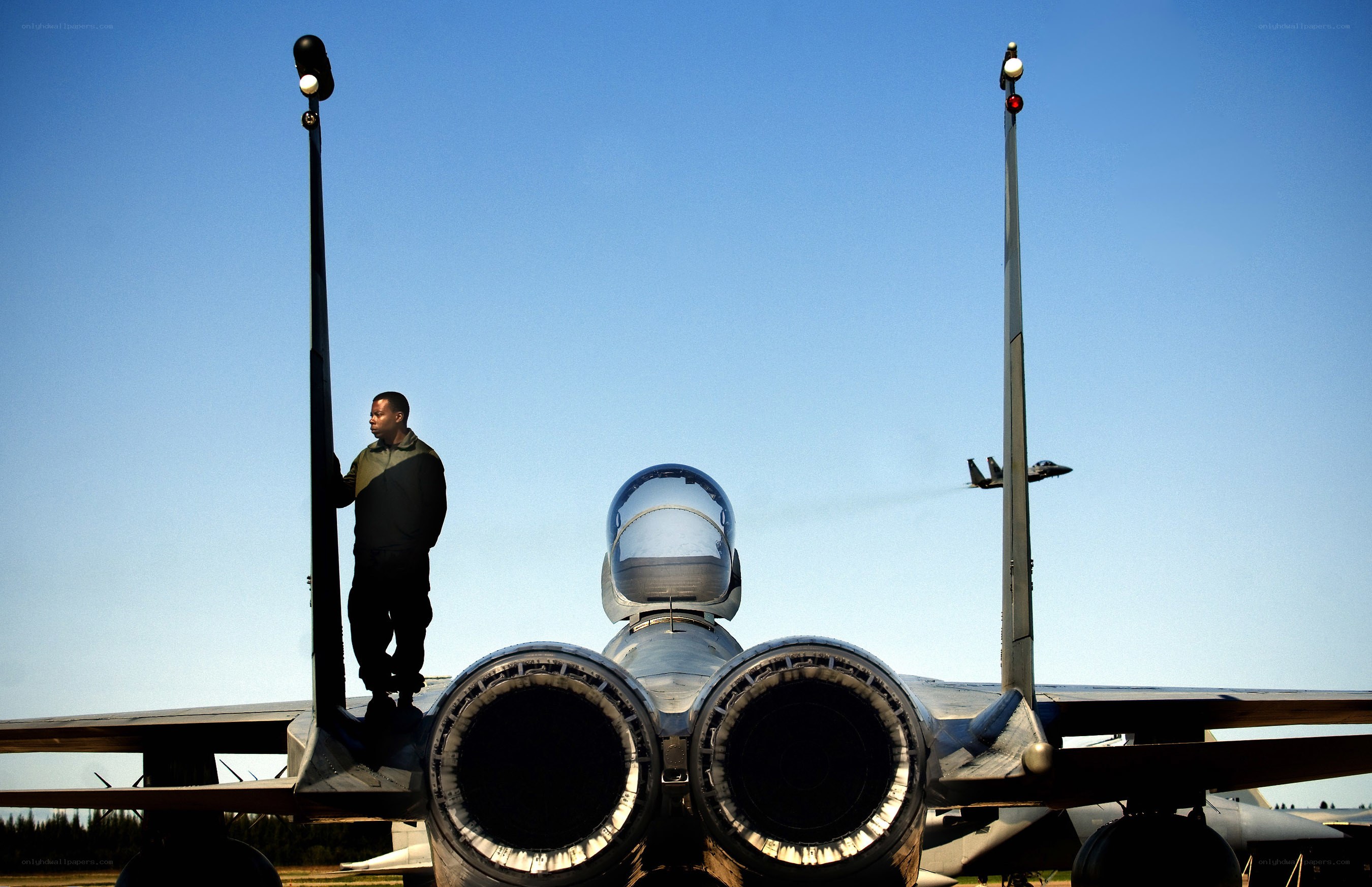Airman near fighter jet