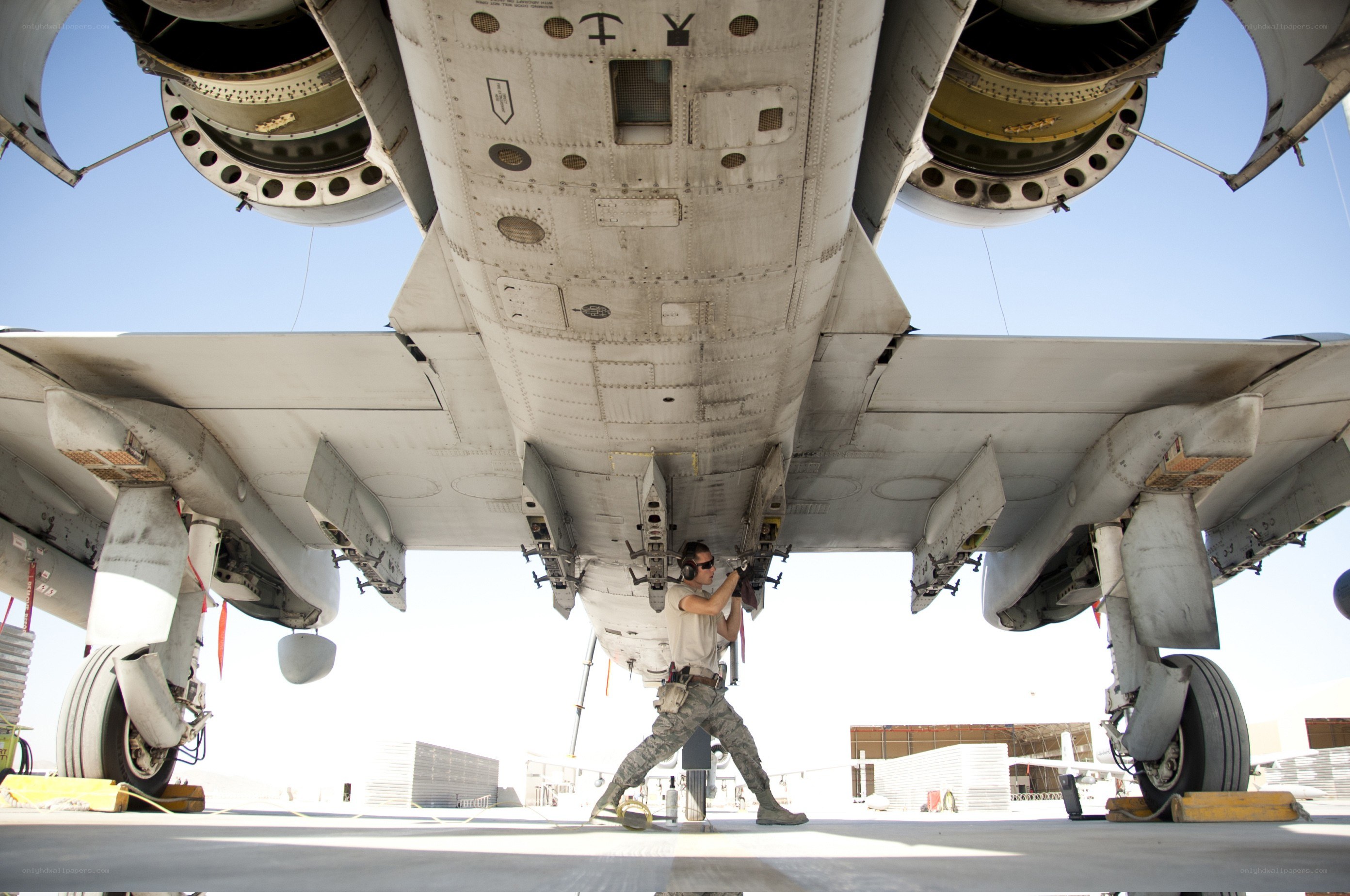 Airman working under aircraft