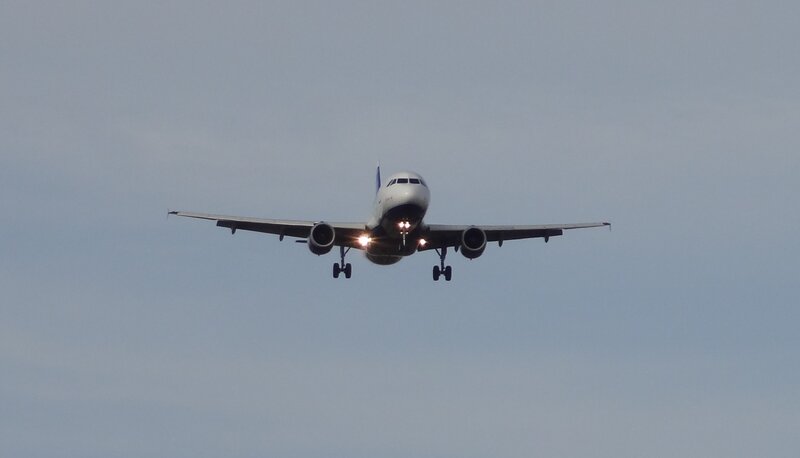 Airplane Approaching for Landing — Gray, Calm