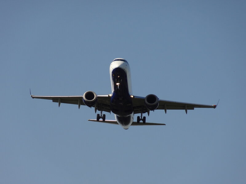 Airplane Approaching Landing — Blue