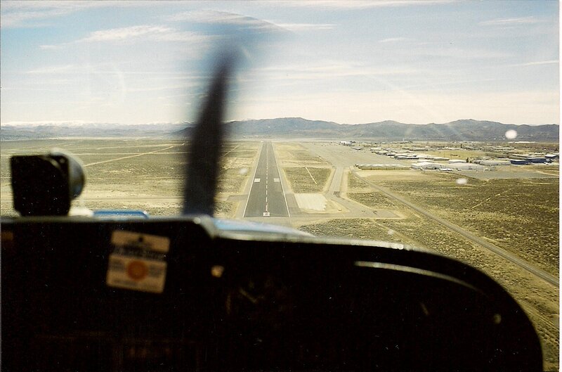 Airplane Approaching Runway — Brown