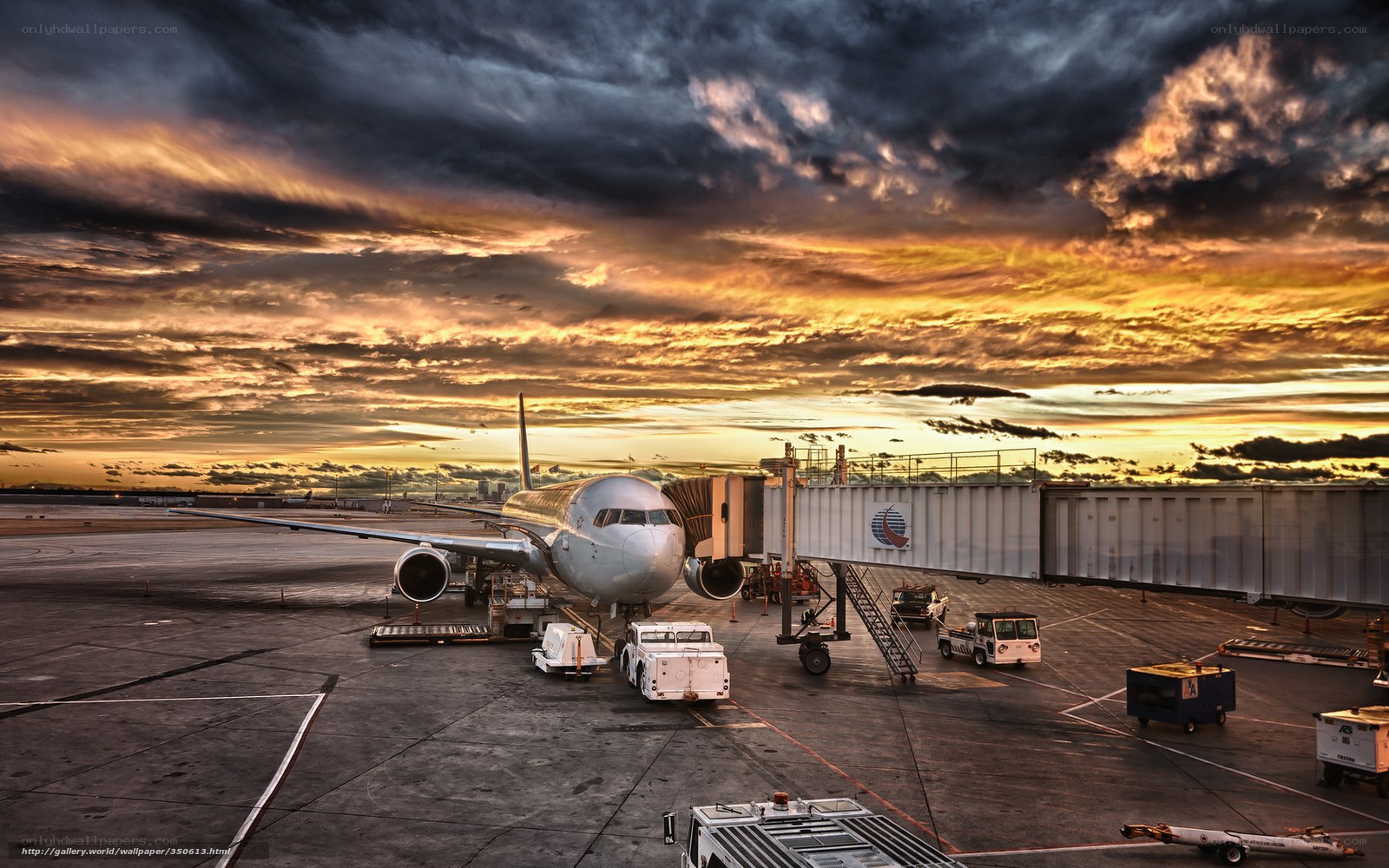 Airplane at airport during sunset