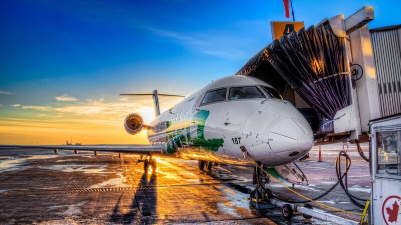 Airplane at Airport Gate — Blue