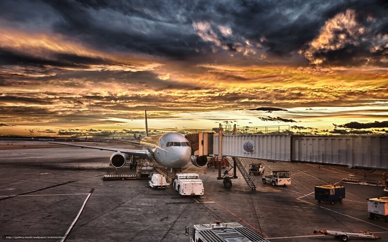 Airplane at Airport Gate — Orange, Dramatic