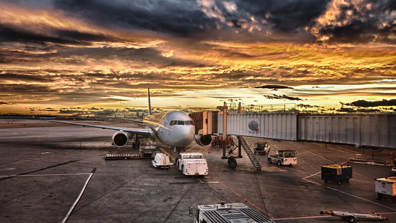 Airplane at Airport Gate — Orange