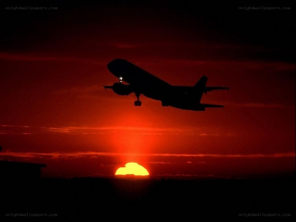 Airplane at sunset