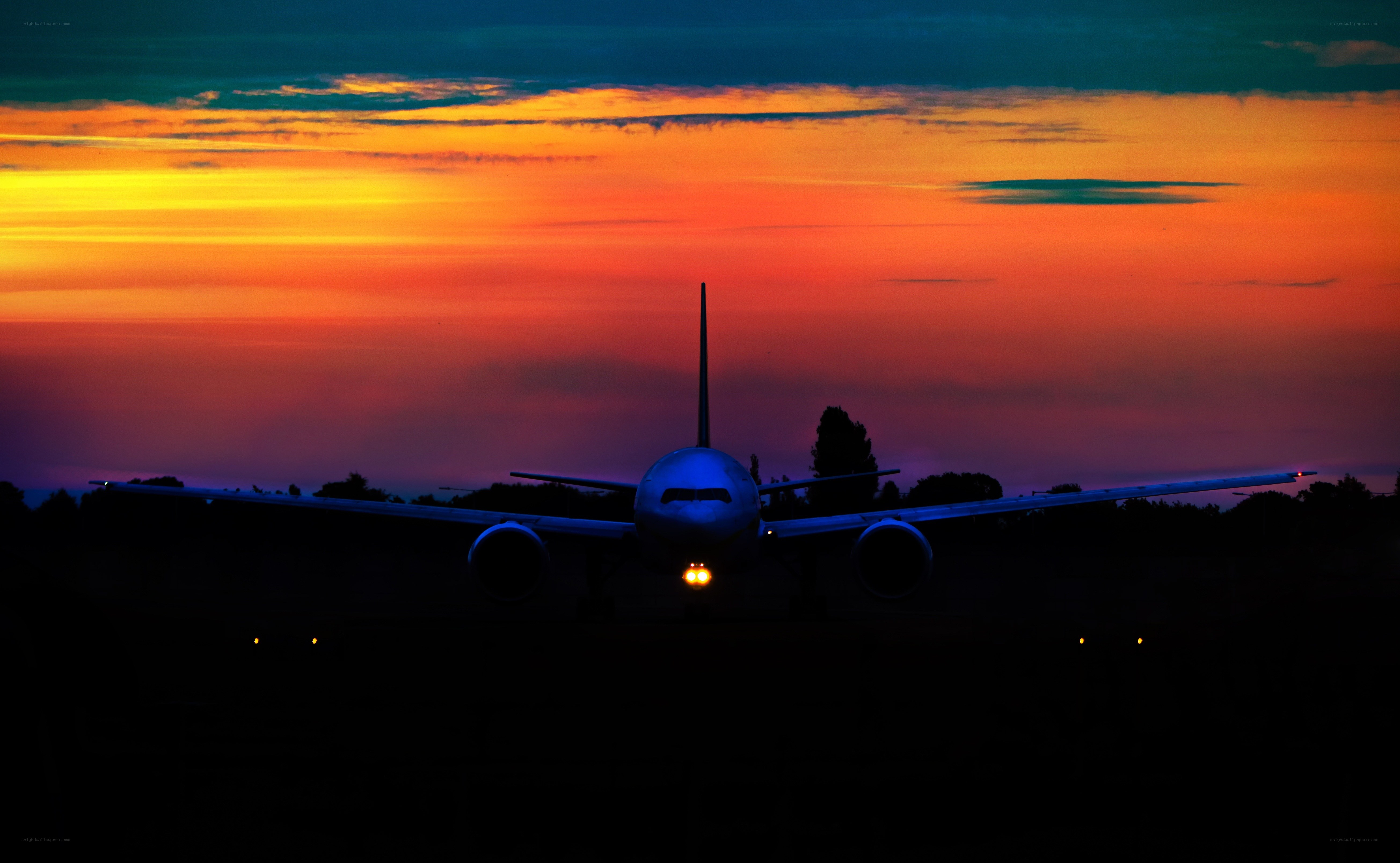 Airplane at sunset on runway