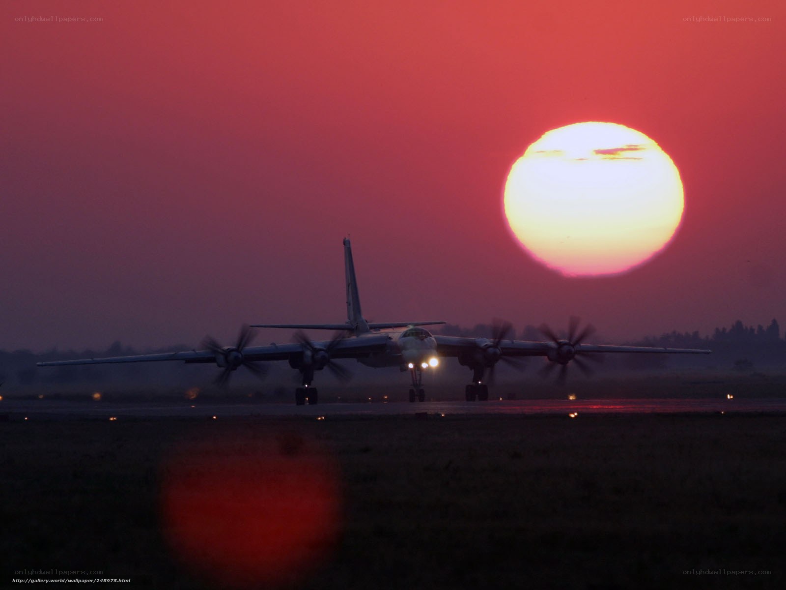 Airplane at sunset on runway