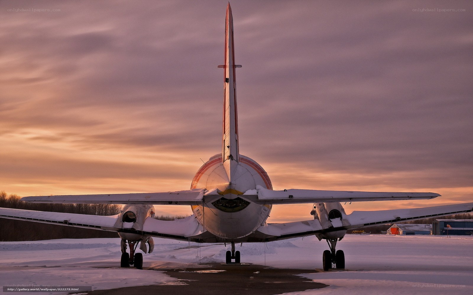 Airplane at sunset on snow