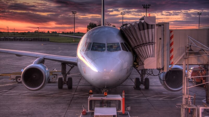 Airplane at sunset on tarmac