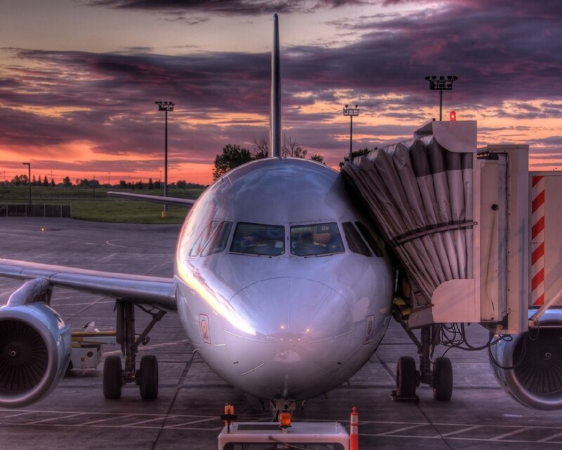 Airplane at sunset on tarmac