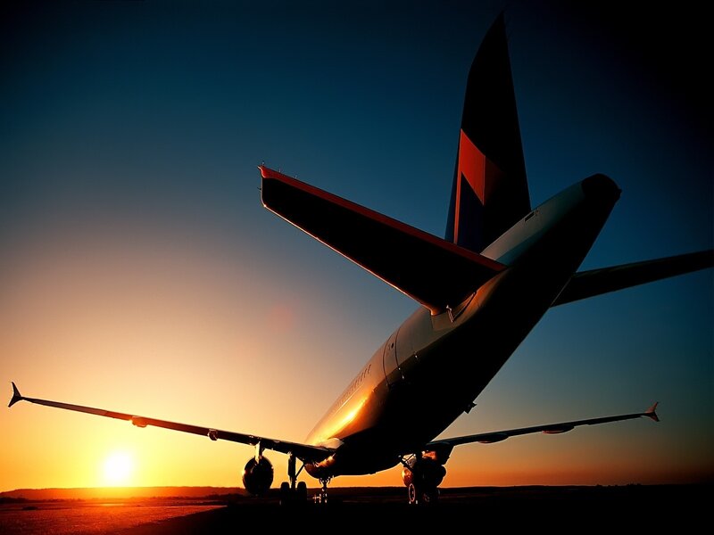 Airplane at sunset on tarmac