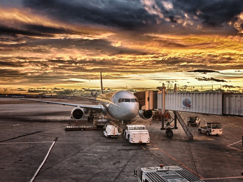 Airplane at sunset on tarmac