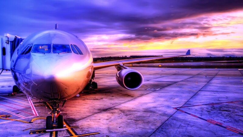 Airplane at sunset on tarmac