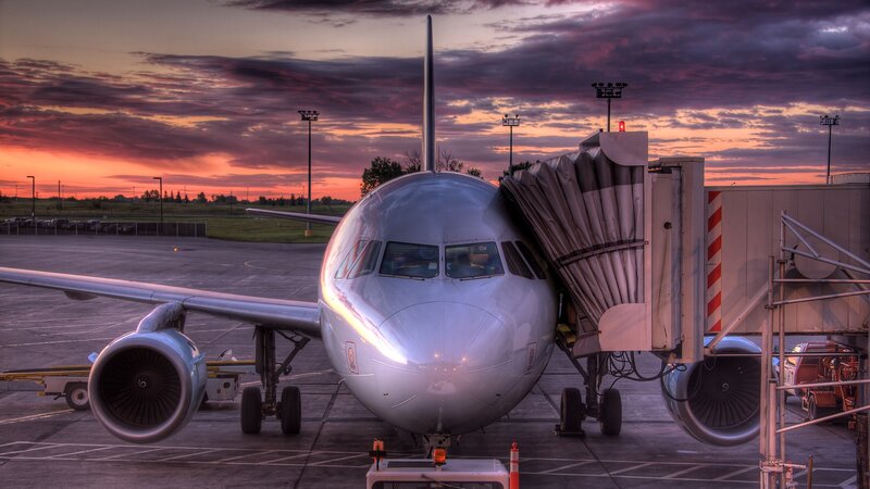 Airplane at sunset on tarmac