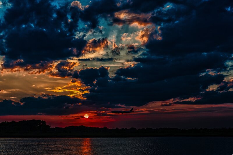 Airplane at Sunset — Orange, Dramatic