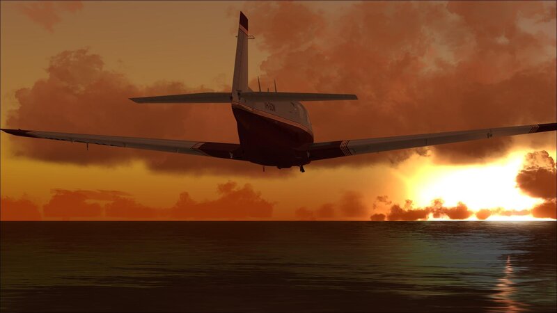 Airplane at sunset over ocean