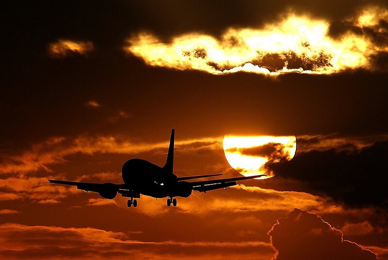 Airplane at sunset silhouette