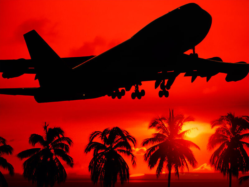 Airplane at tropical sunset