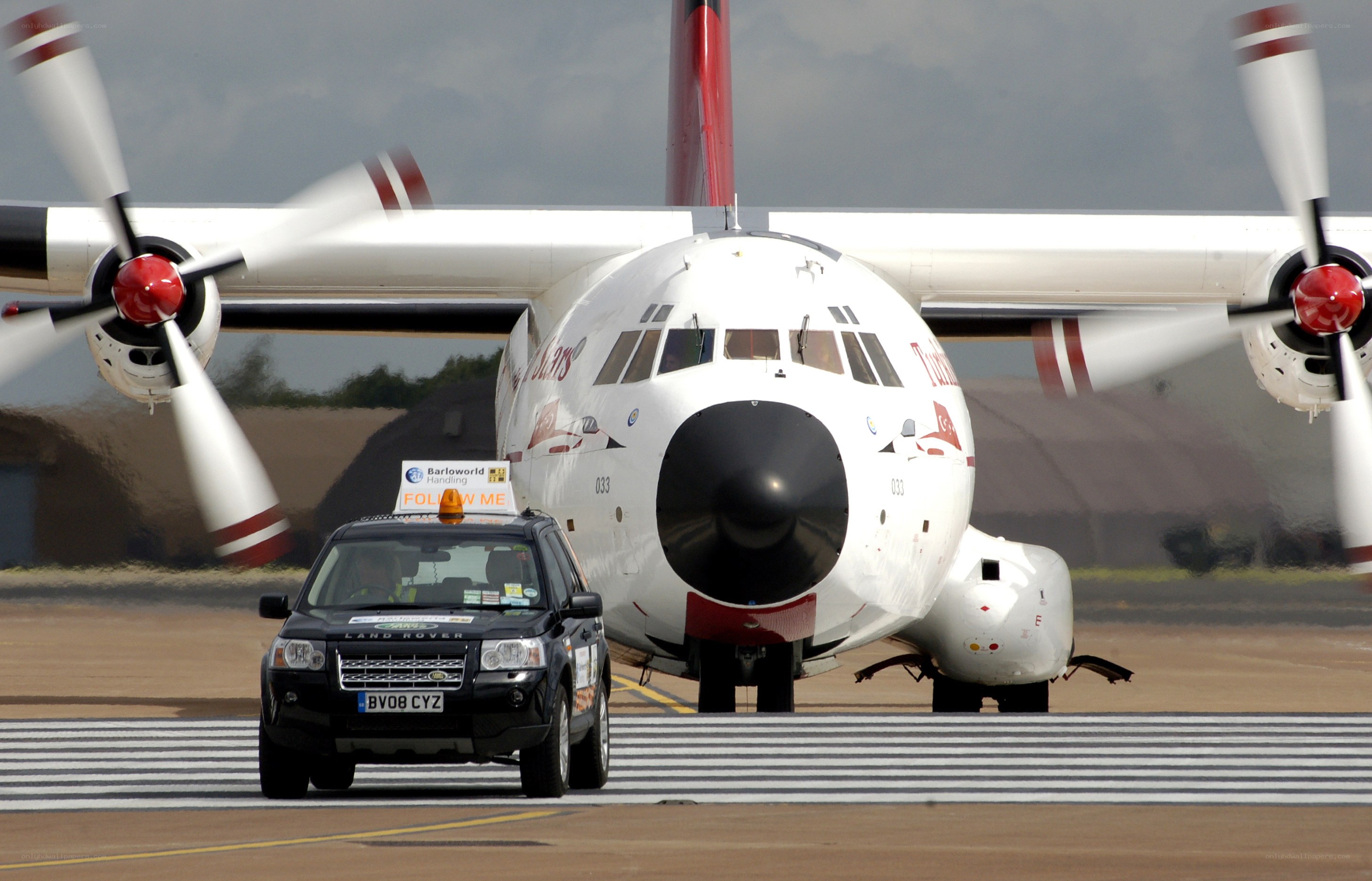 Airplane being guided on tarmac