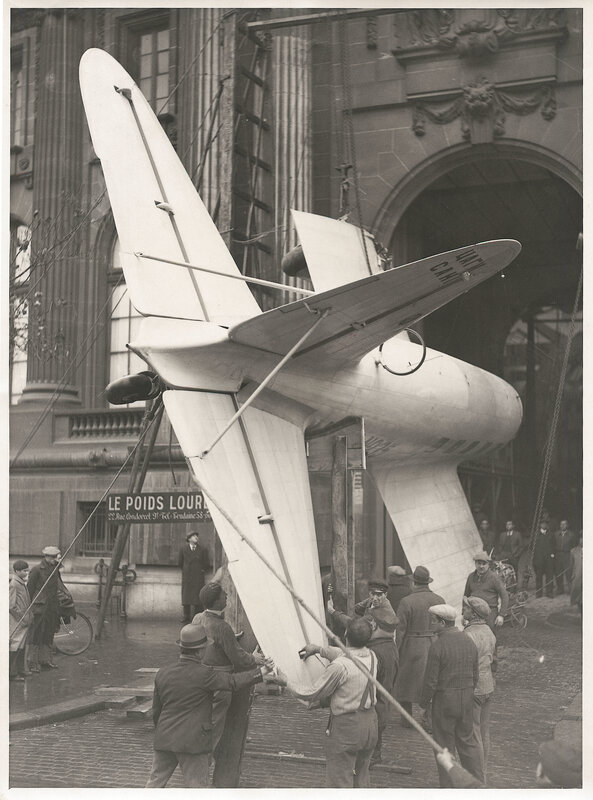 Airplane being lifted by crane