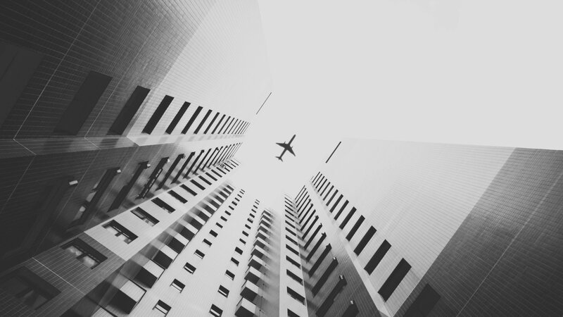 Airplane Between Skyscrapers
