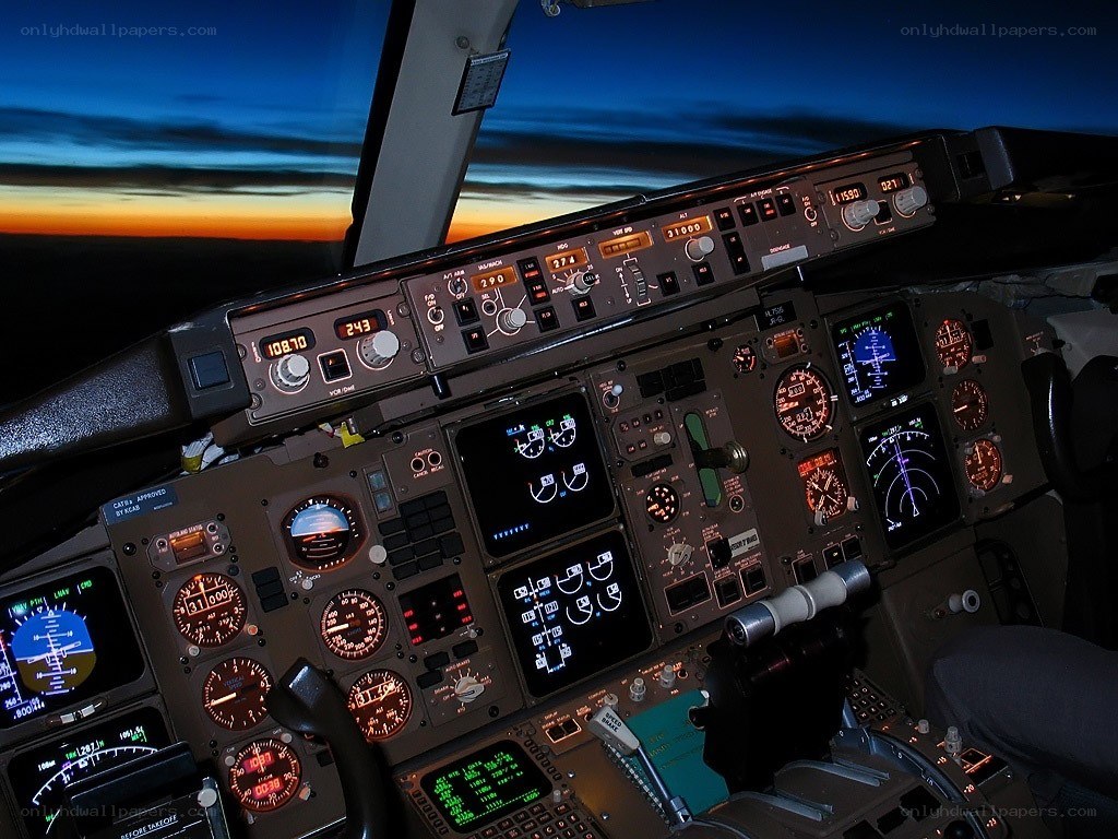 Airplane cockpit at sunset
