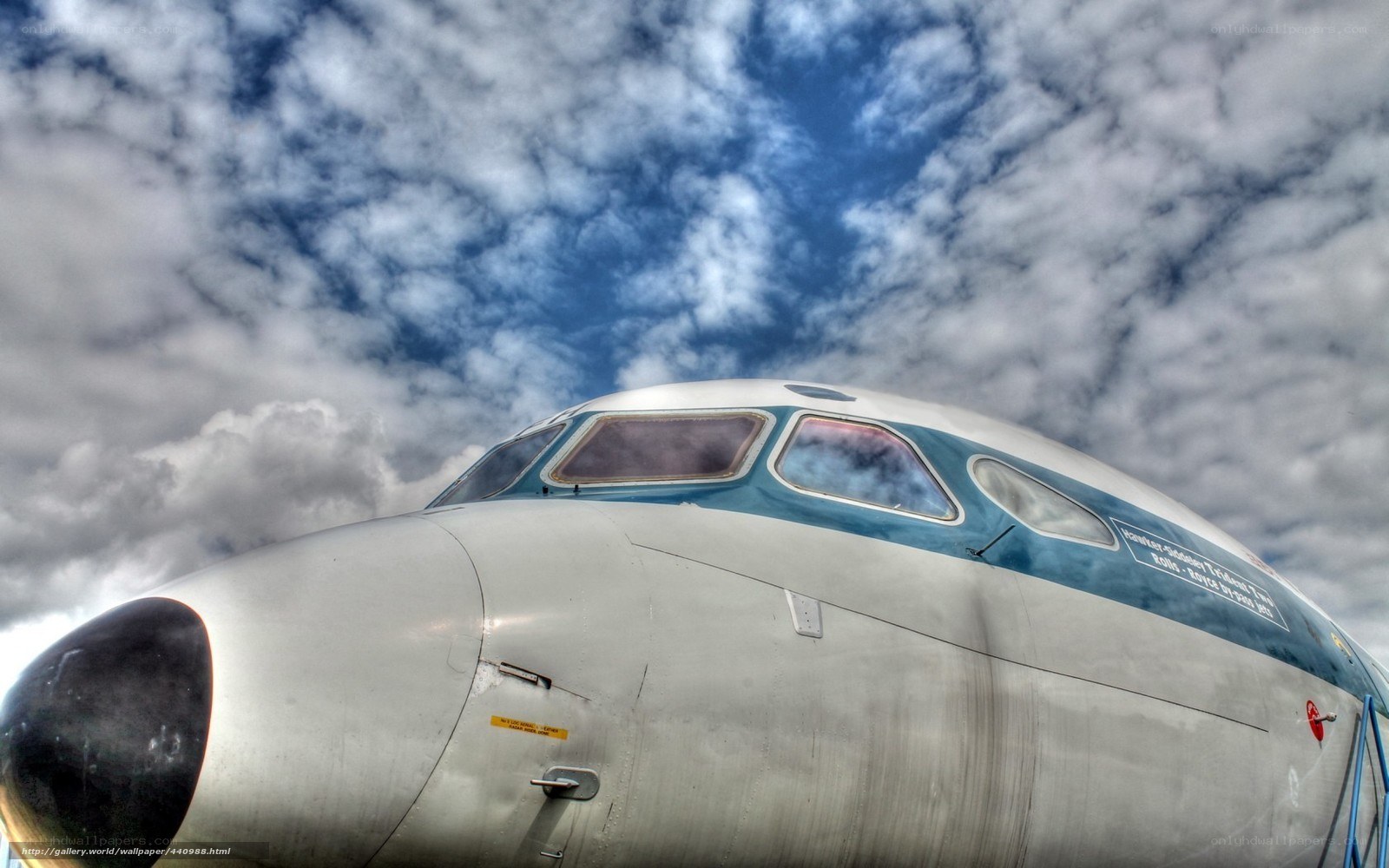airplane cockpit under cloudy sky