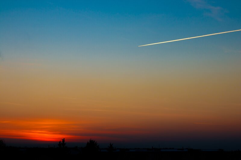 Airplane Contrail at Sunset — Blue