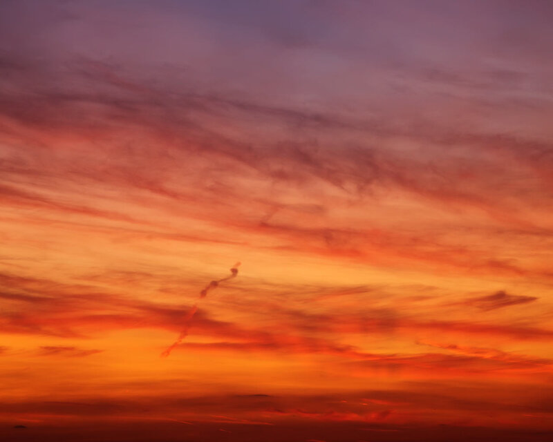 Airplane Contrail at Sunset — Orange