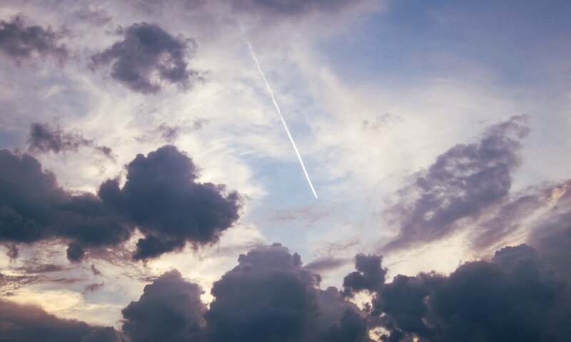 Airplane Contrail in Sky — Blue, Dramatic, Sunset