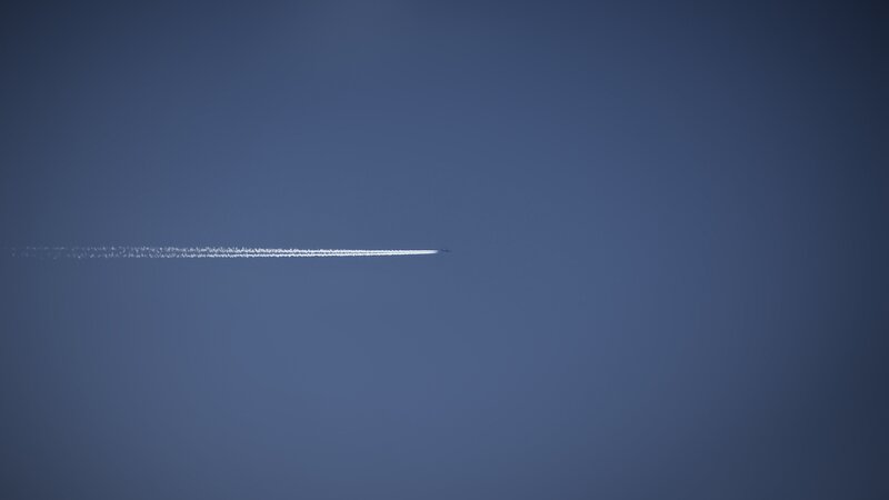 Airplane Contrail in Sky — Blue, Serene