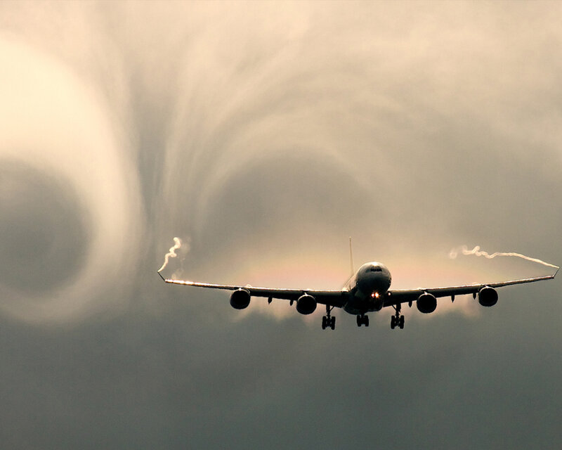 Airplane creating vapor cones