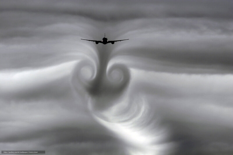 Airplane creating wingtip vortices