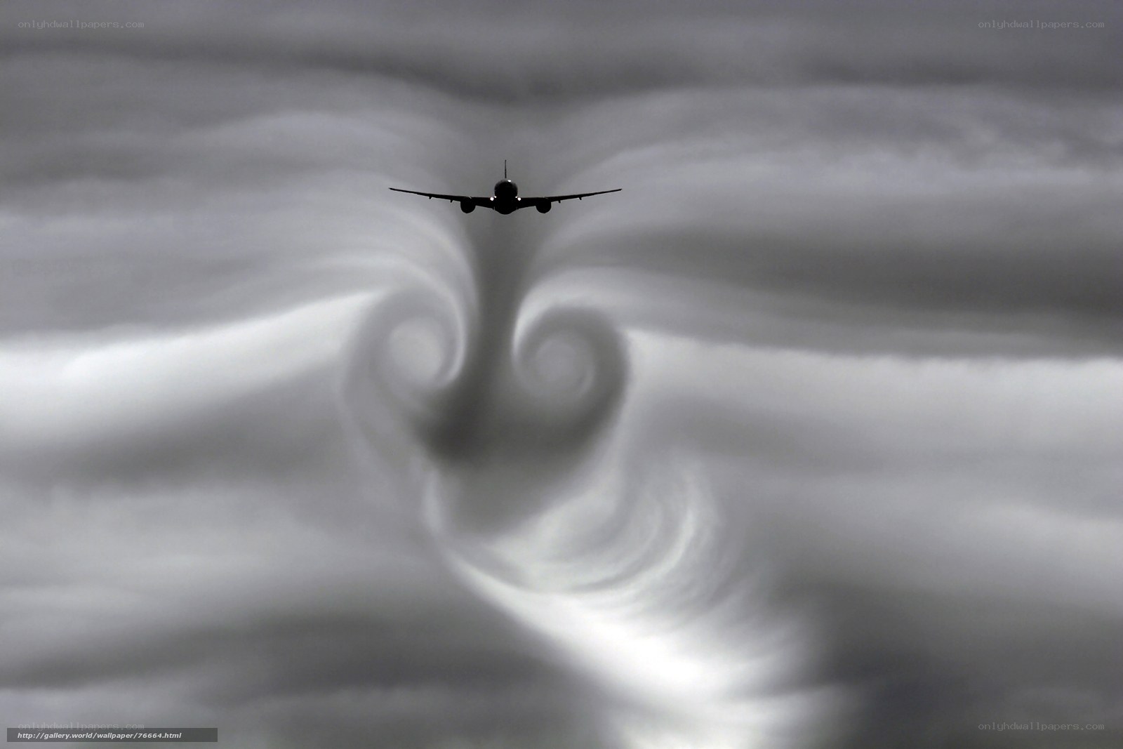 Airplane creating wingtip vortices
