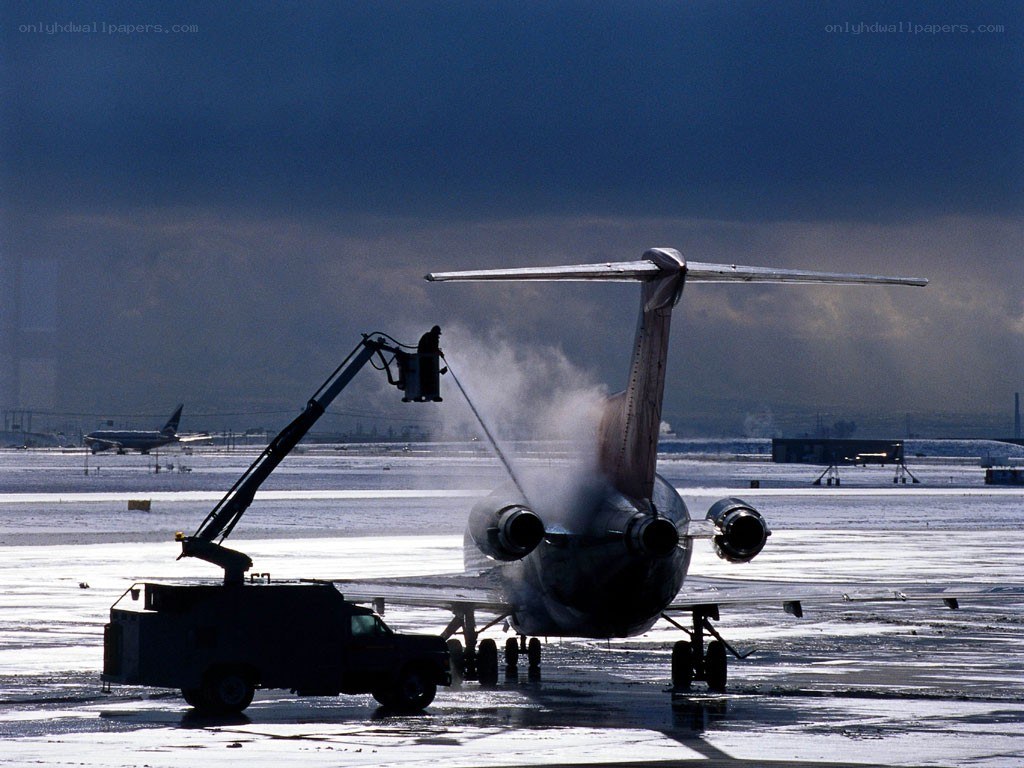 Airplane de-icing at airport