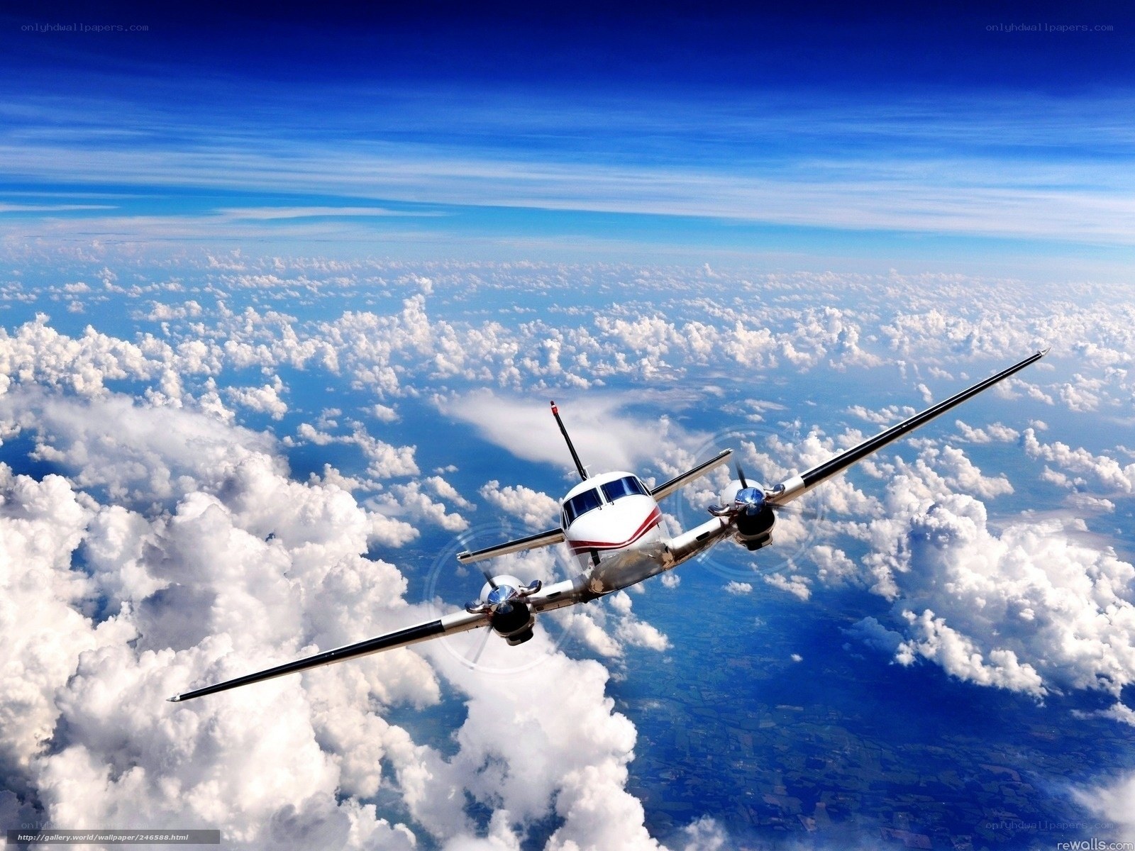 Airplane flying above clouds