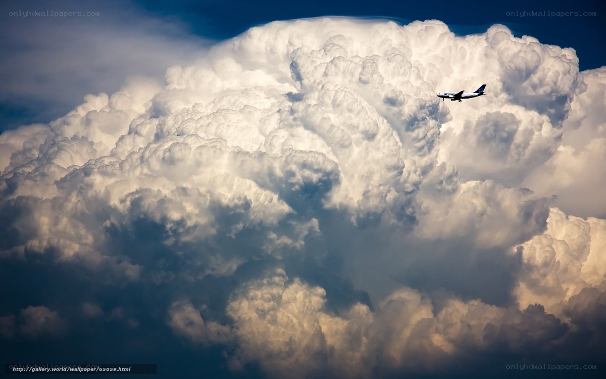 Airplane flying above clouds