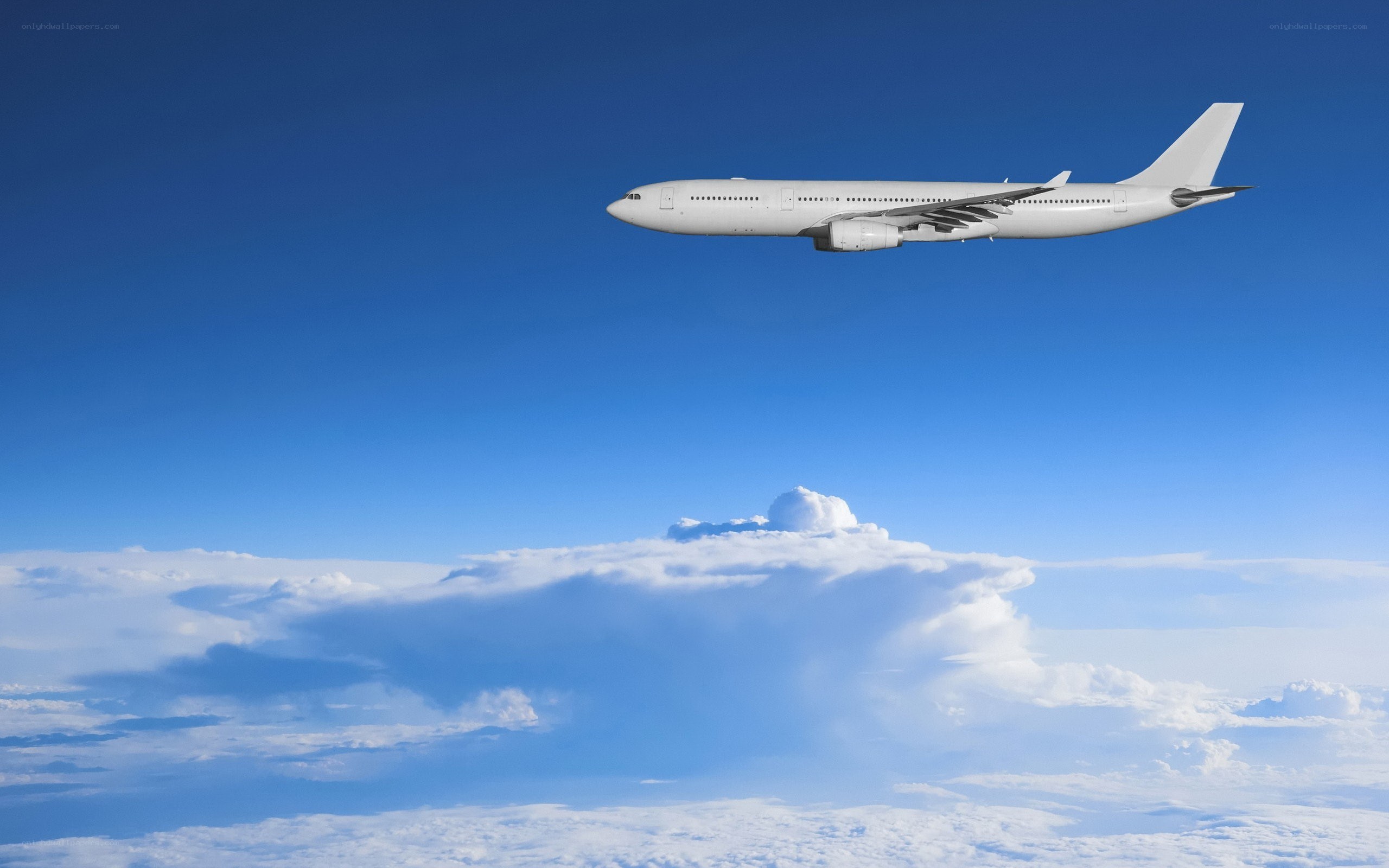 Airplane flying above clouds