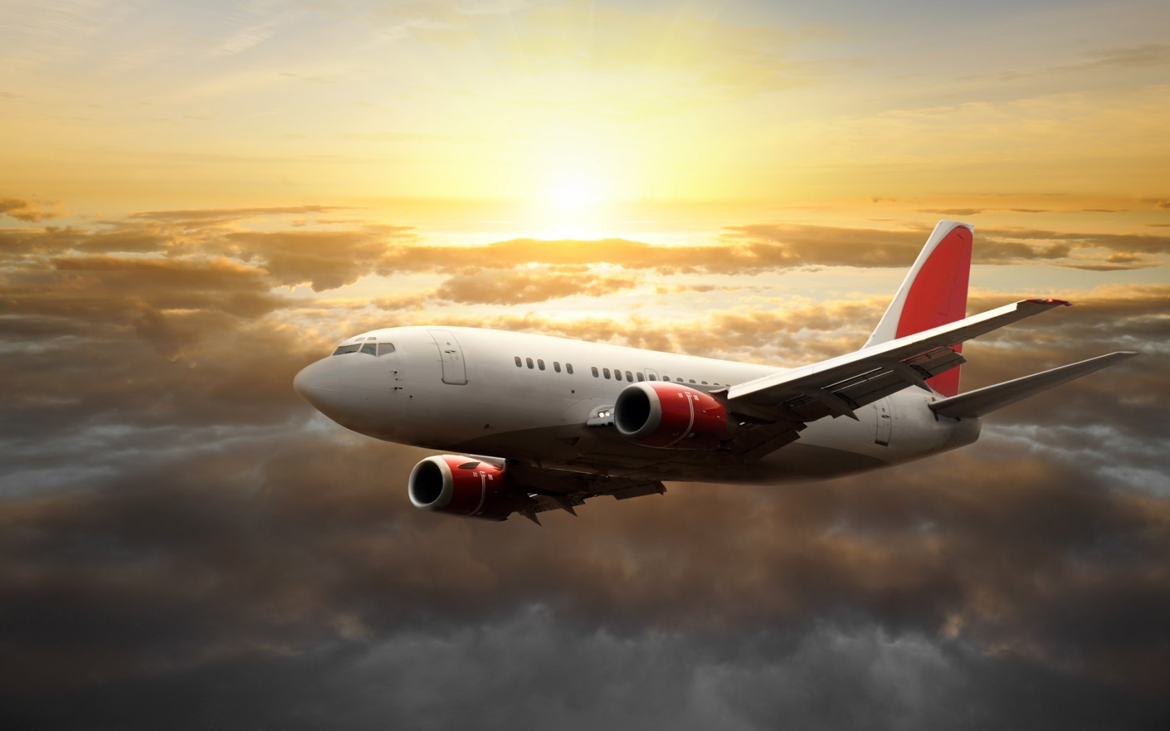 Airplane flying above clouds