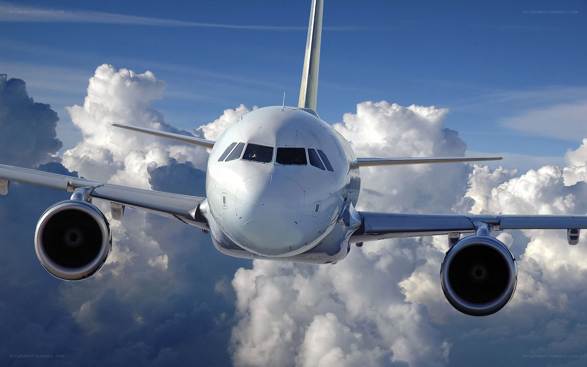 airplane flying above clouds