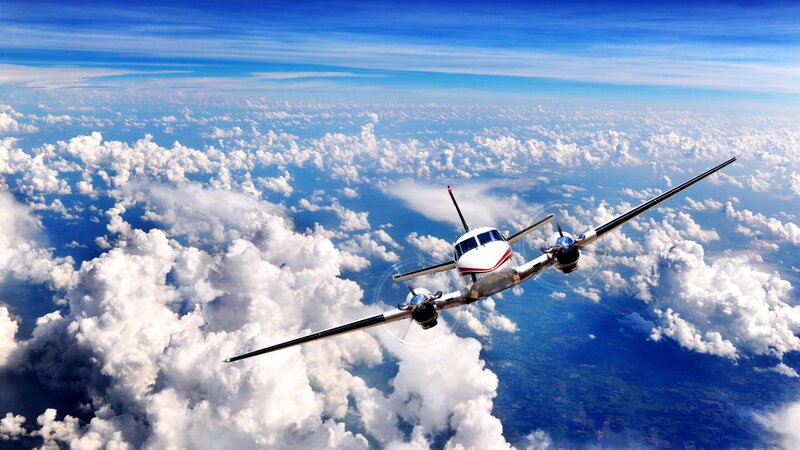 Airplane flying above clouds