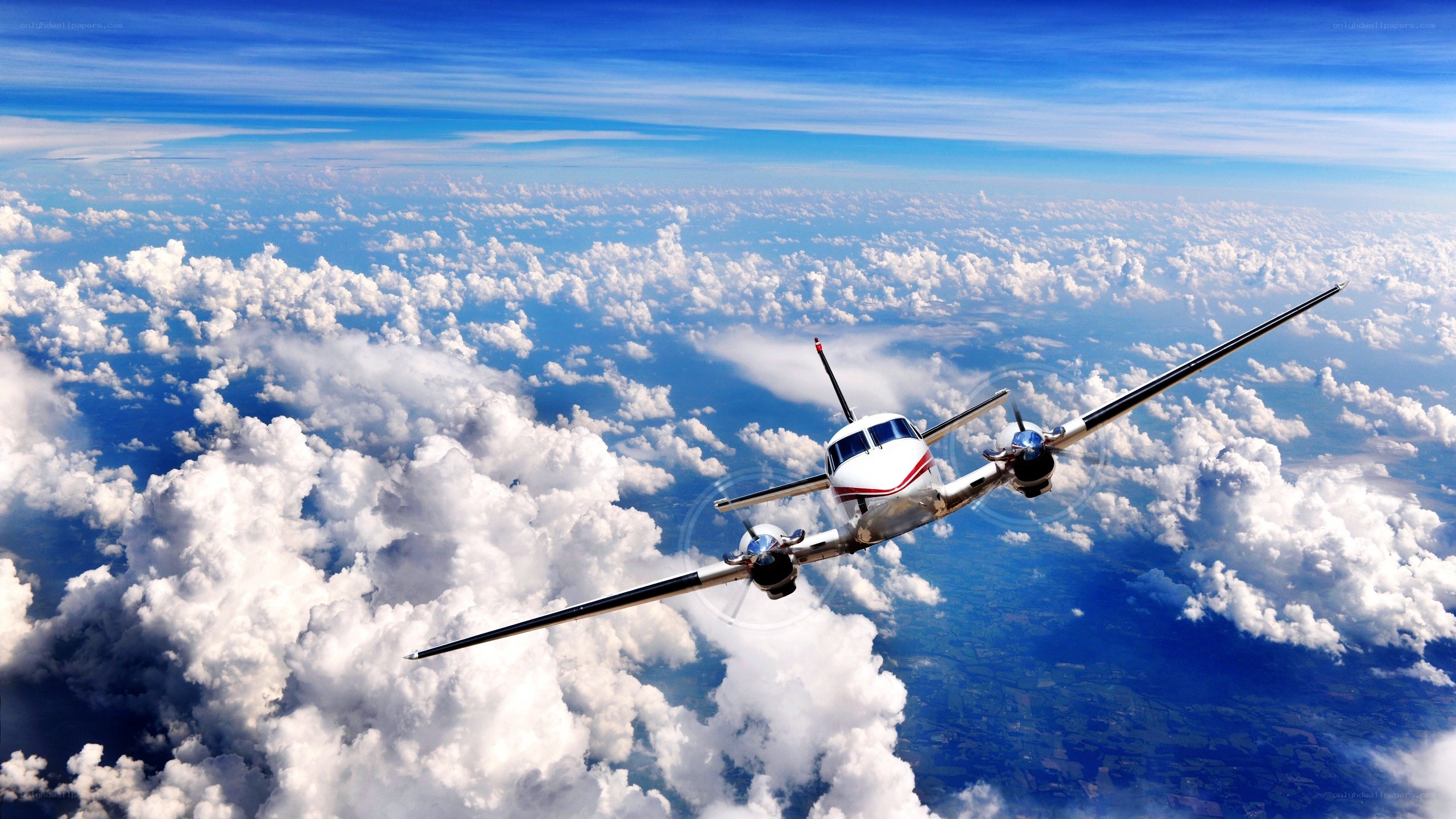 Airplane flying above clouds
