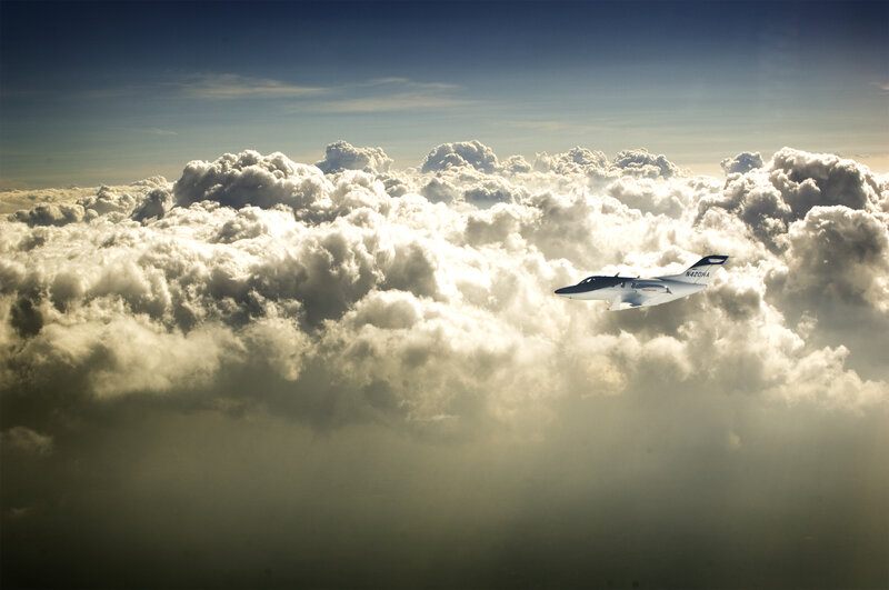 Airplane flying above clouds