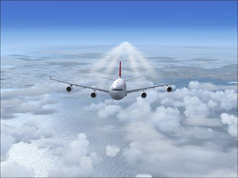 airplane flying above clouds