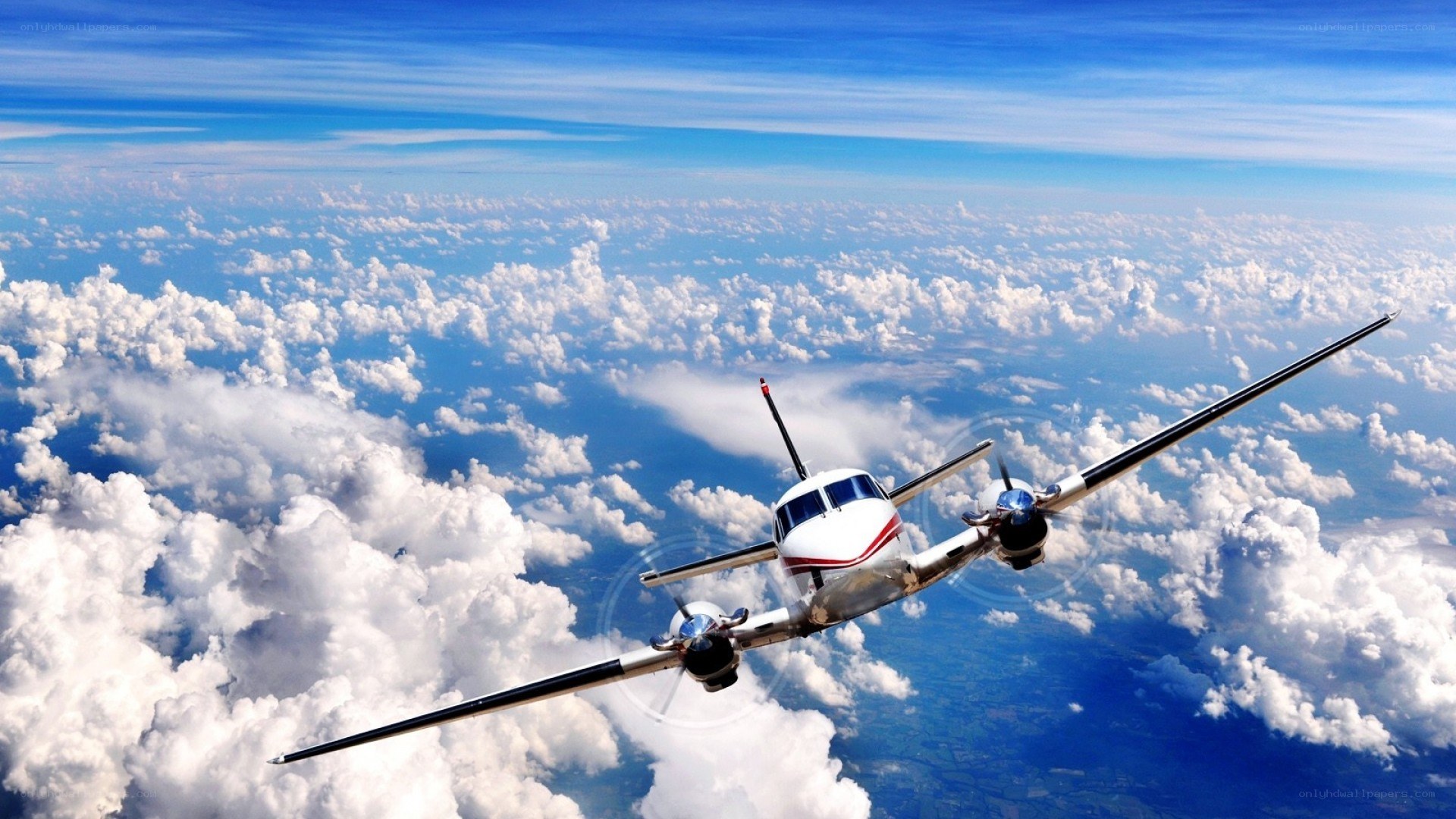 Airplane flying above clouds